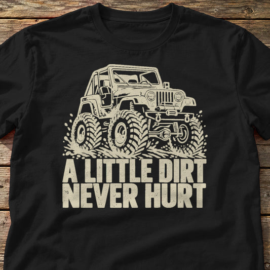 A Little Dirt Never Hurt t-shirt in Black, laid flat on weathered wood