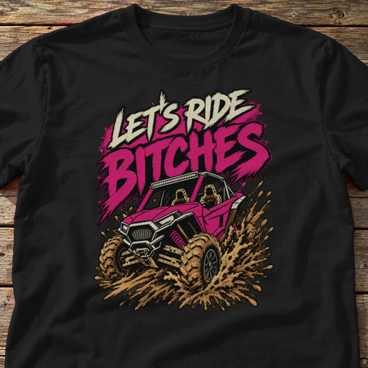 Let's Ride Bitches t-shirt in Black, laid flat on weathered wood