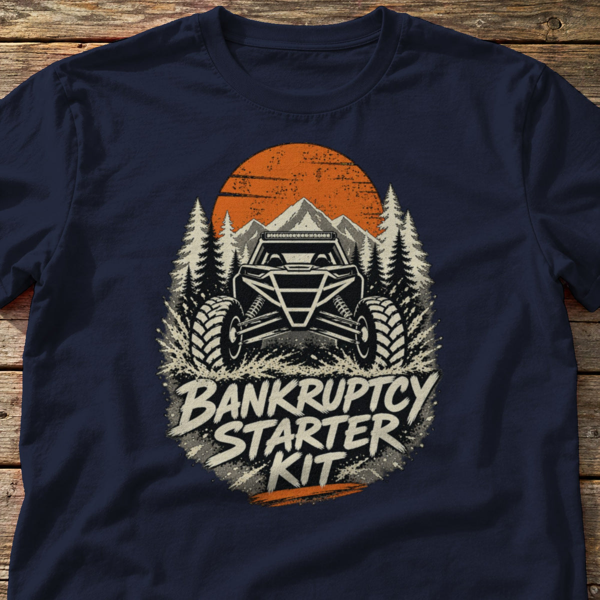 Bankruptcy Starter Kit t-shirt in Navy, laid flat on weathered wood