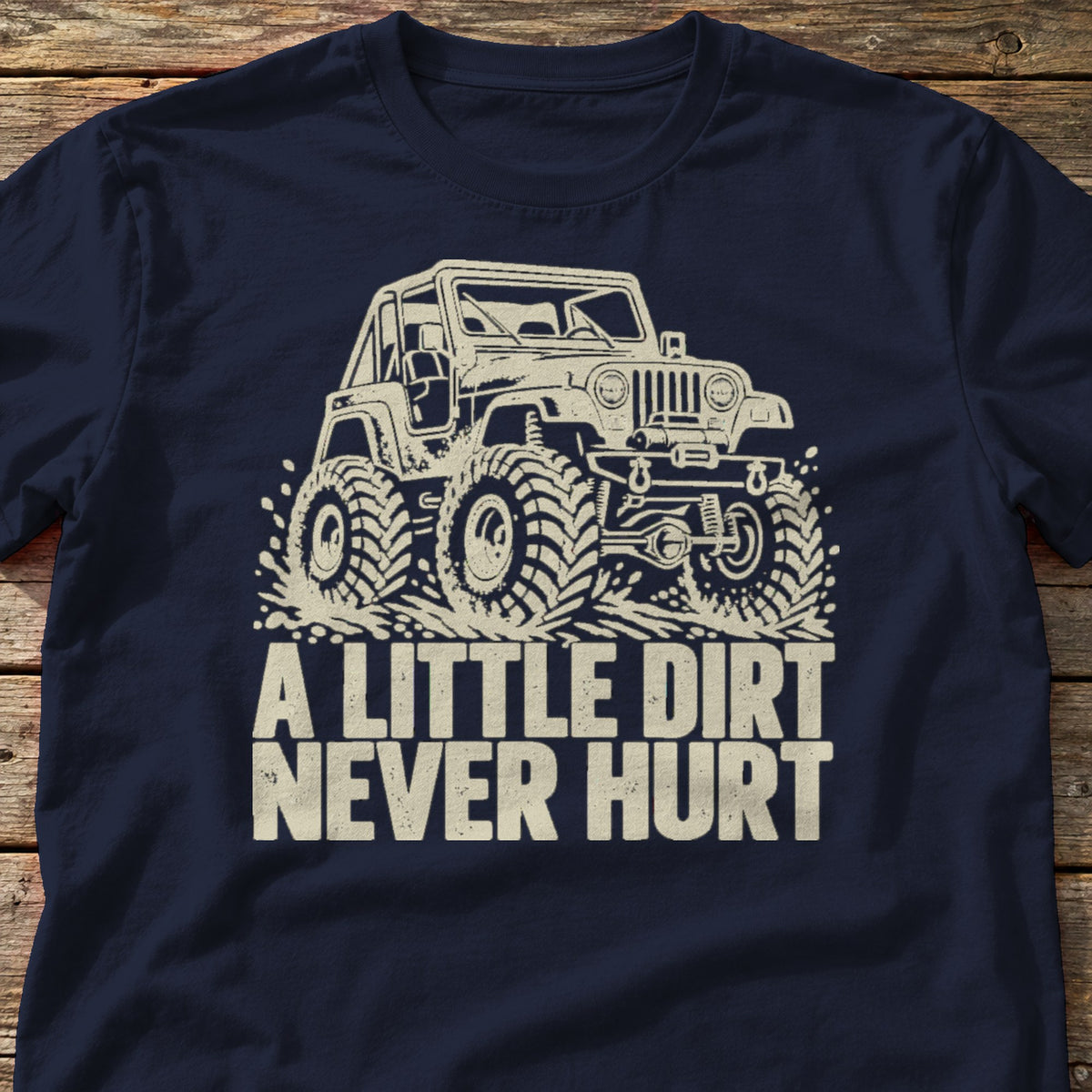 A Little Dirt Never Hurt t-shirt in Navy, laid flat on weathered wood