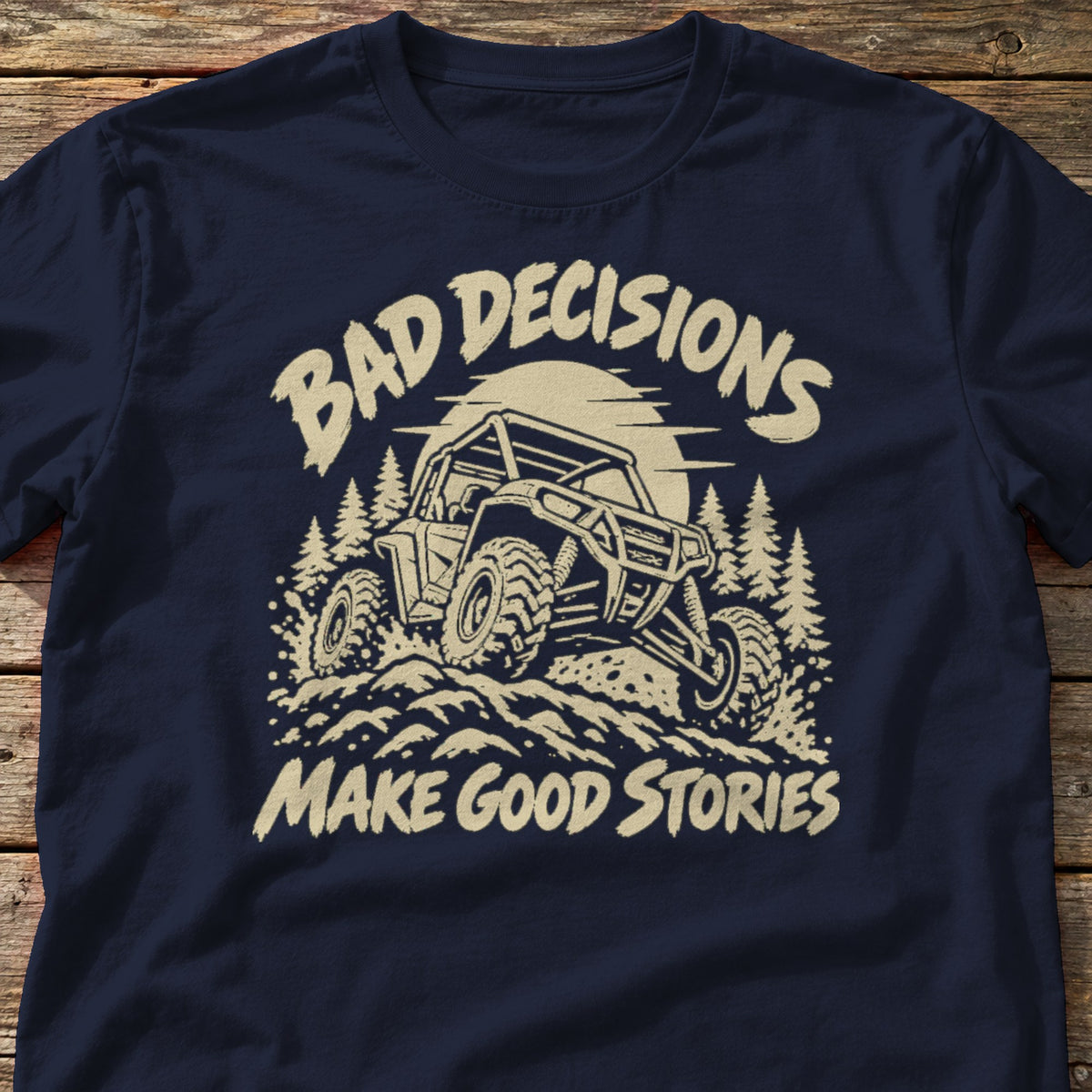 Bad Decisions Make Good Stories t-shirt in Navy, laid flat on weathered wood