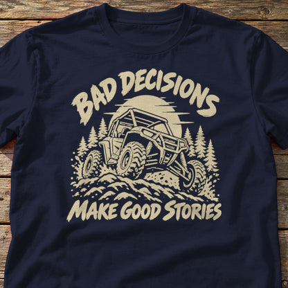 Bad Decisions Make Good Stories t-shirt in Navy, laid flat on weathered wood