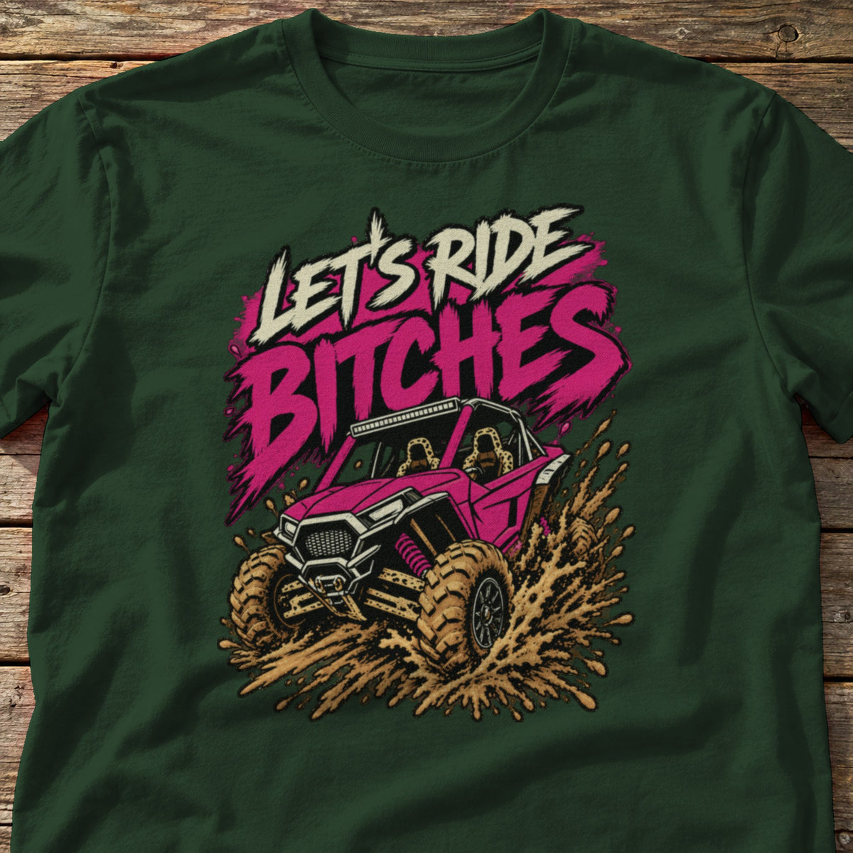 Let's Ride Bitches t-shirt in Forest Green, laid flat on weathered wood
