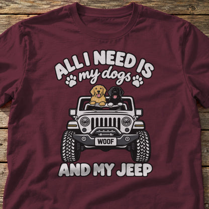 All I Need Is My Dogs and My 4x4 t-shirt in Maroon, laid flat on weathered wood