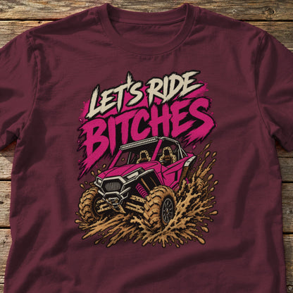Let's Ride Bitches t-shirt in Maroon, laid flat on weathered wood
