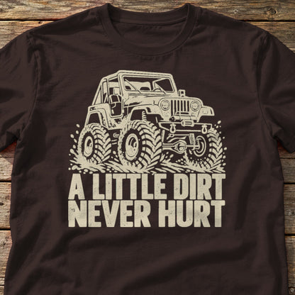 A Little Dirt Never Hurt t-shirt in Dark Chocolate, laid flat on weathered wood