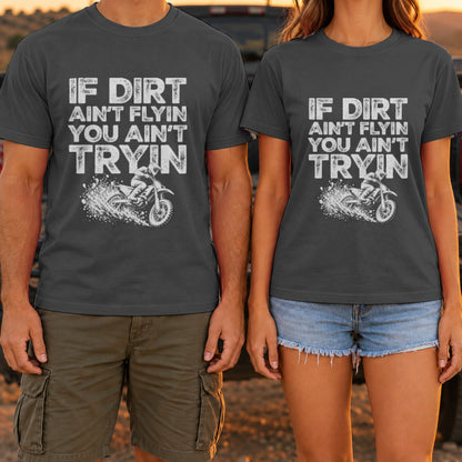 If Dirt Ain't Flyin You Ain't Tryin t-shirt in Dark Heather, worn by a couple at a truck tailgate