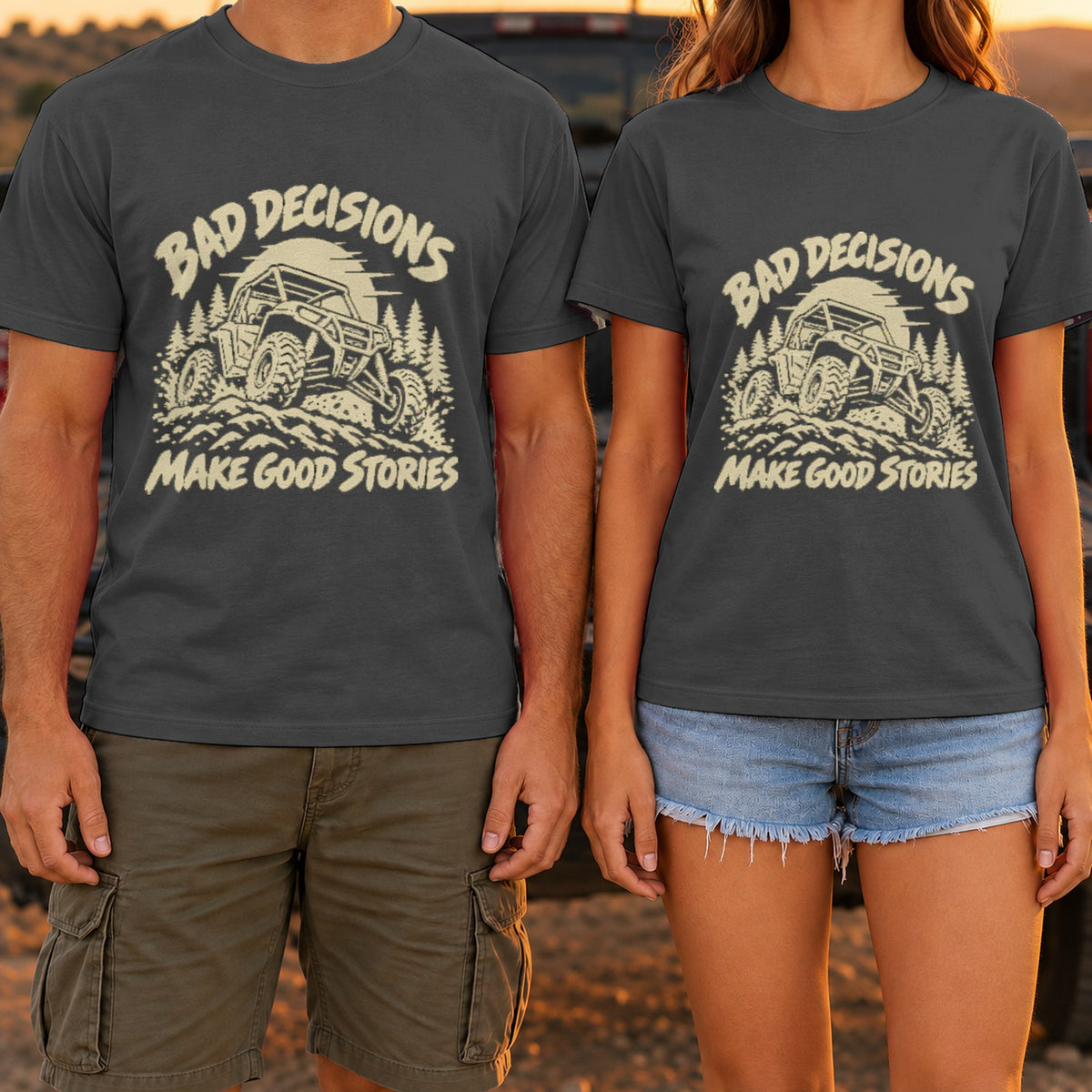 Bad Decisions Make Good Stories t-shirt in Dark Heather, worn by a couple at a truck tailgate